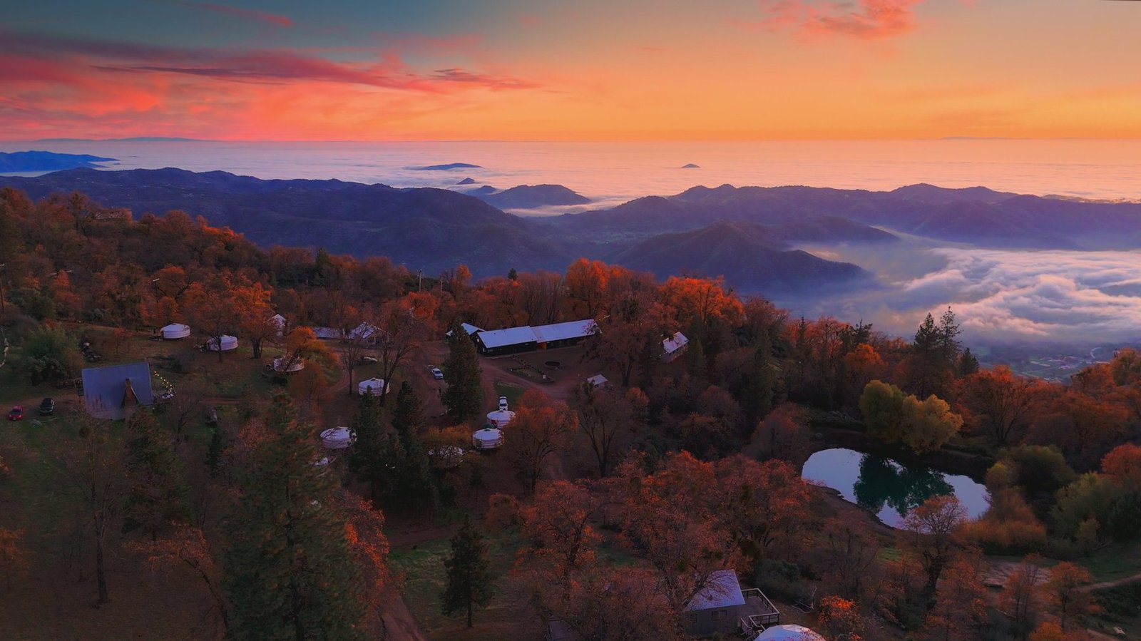 Sunset over the Sierra Nevada foothills, with clouds filling the valleys below Sequoia Highland Camp